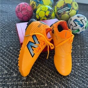 New Balance Orange Soccer Shoes - women 7, 7.5 / men 5.5, 6